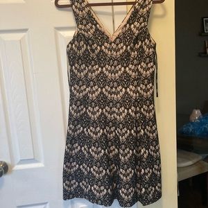 Dressy dress. Light taupe with black net/Lacey over lay. Size 8